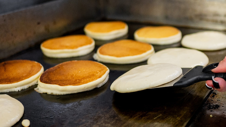 Making pancakes on a griddle