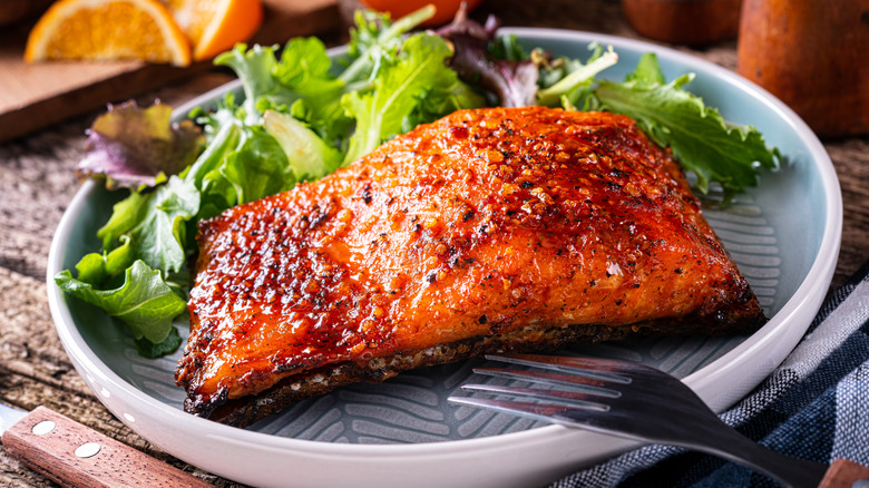 Glazed salmon with side of mixed greens