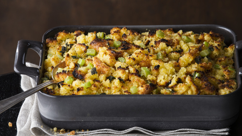 A tray of stuffing cooling outside of the oven