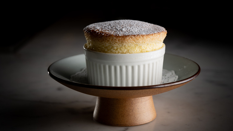 A highly risen dessert soufflé sitting in a dish.