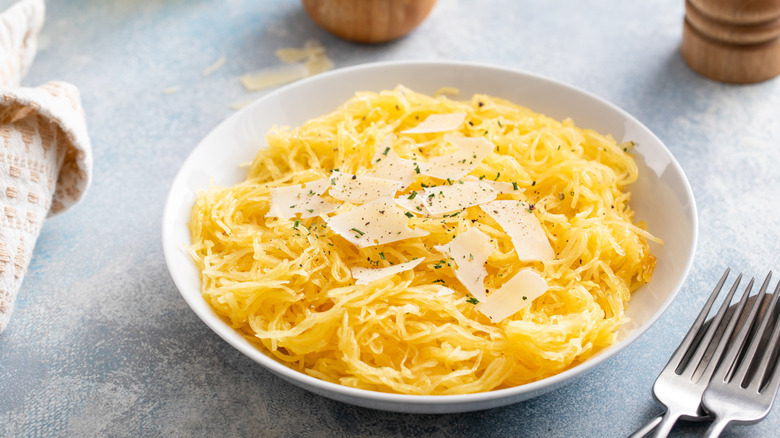 a bowl of spaghetti squash with parmesan cheese