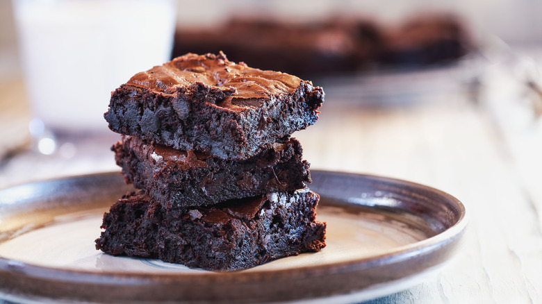 fudgy brownies stacked on a plate