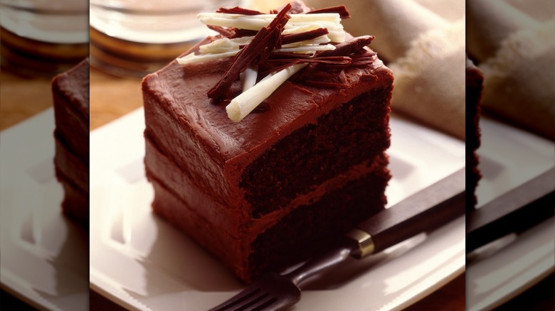 chocolate layer cake garnished with chocolate shavings