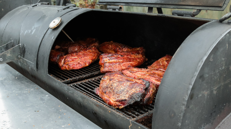 Large cuts of meat on grill