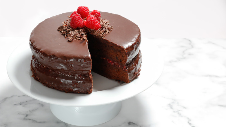 chocolate cake with chocolate ganache and raspberry garnish