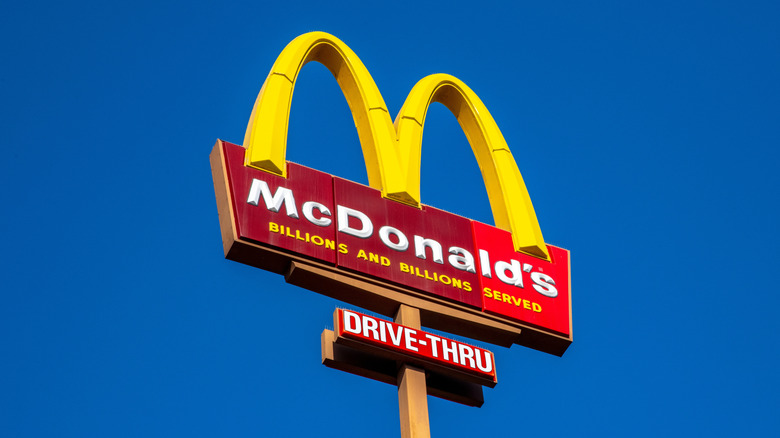 A McDonald's sign in the sky during the day