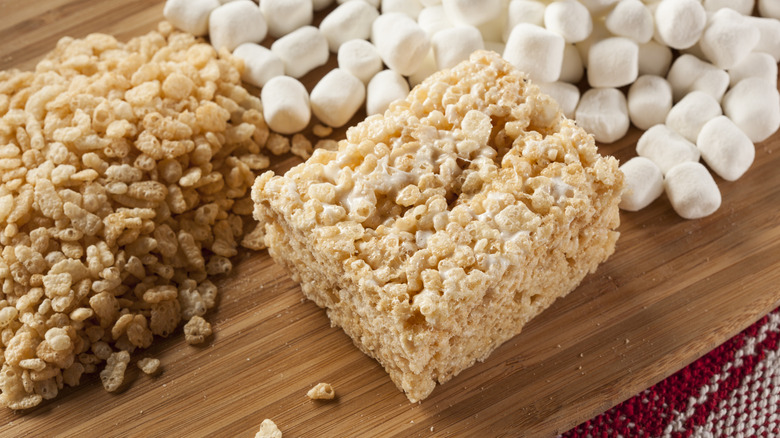 Rice Krispie treat on board with rice cereal and mini marshmallows