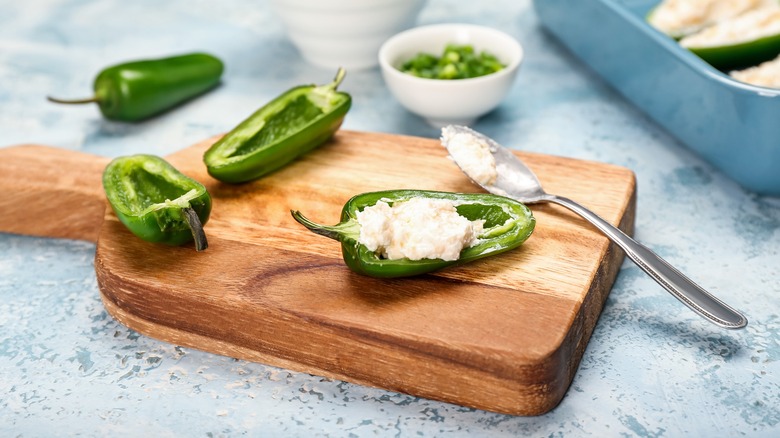 Stuffing jalapenos with cream cheese