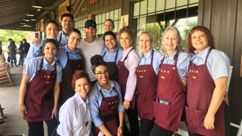 A Cracker barrel employees smiling