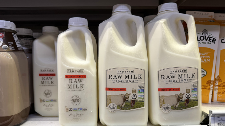 Half gallons of raw milk sit on a shelf