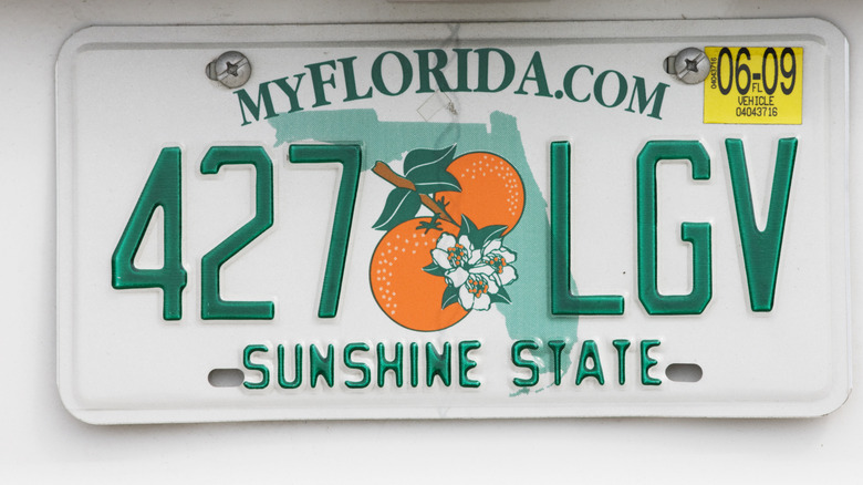 A Florida license plate containing the words "sunshine state."