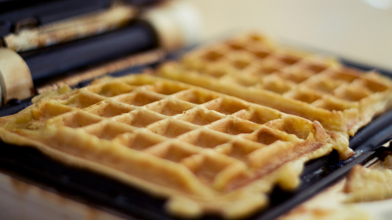 Freshly made waffles in a rectangular waffle maker