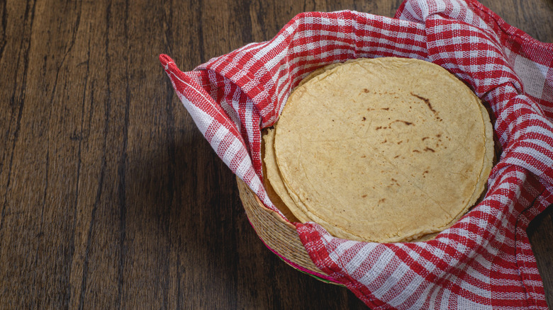 Stack of tortillas in a cloth-lined basket