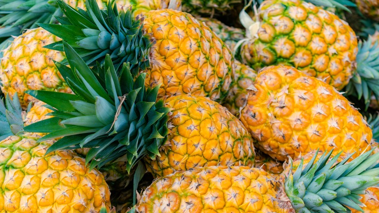 pile of whole fresh pineapples