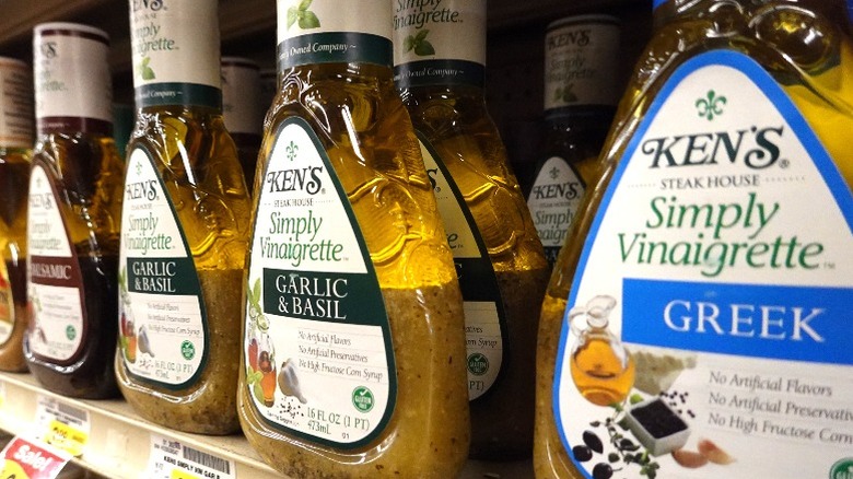 A row of Ken's Steakhouse dressings on a store shelf.