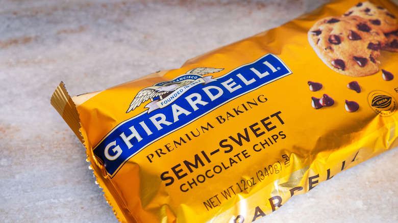 A packet of Ghirardelli chocolate chips placed on a counter.