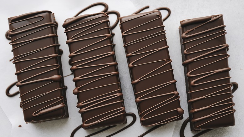 chocolate drizzled onto chocolate bars