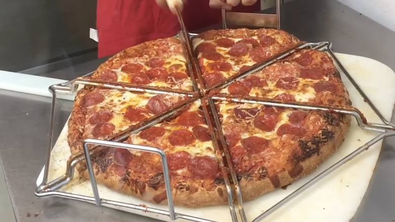 Costco pizza being sliced