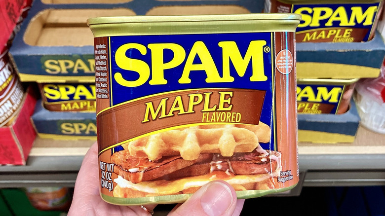 Close-up of hand holding can of maple-flavored Spam