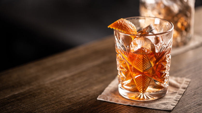 old fashioned cocktail with orange garnish