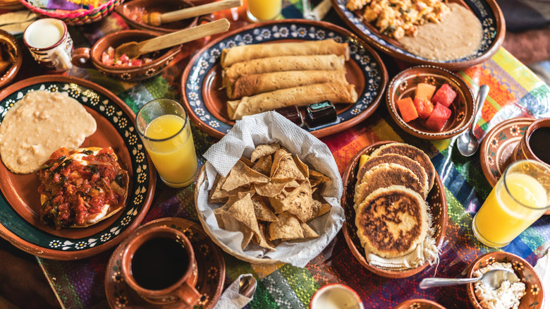 An assortment of Mexican foods on a colorful tablecloth