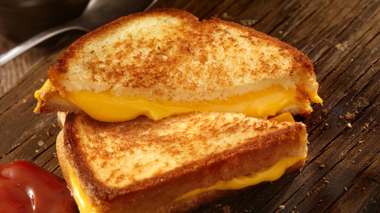 Close up of grilled cheese sandwich cut in half