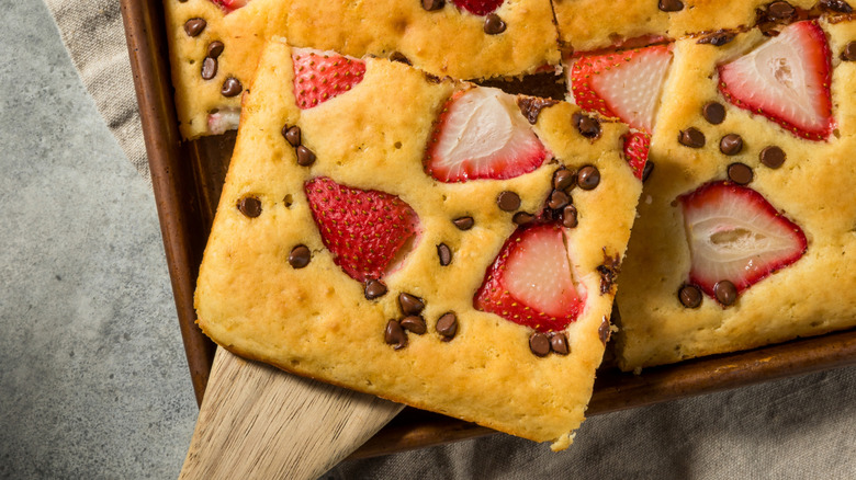 Sheet pan pancakes with chocolate chips and strawberries