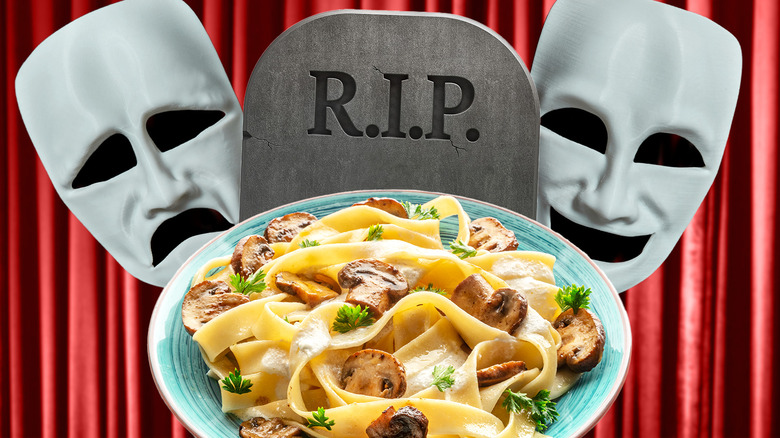 Comedy and tragedy masks surrounding a dinner plate and gravestone against a red curtain