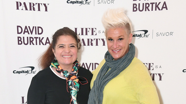 Alex Guarnaschelli smiling with Anne Burrell