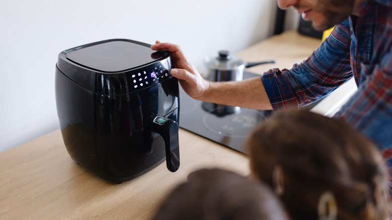 People using an air fryer