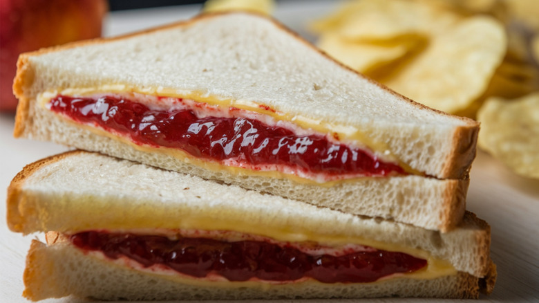 A peanut butter and jelly sandwich cut in half