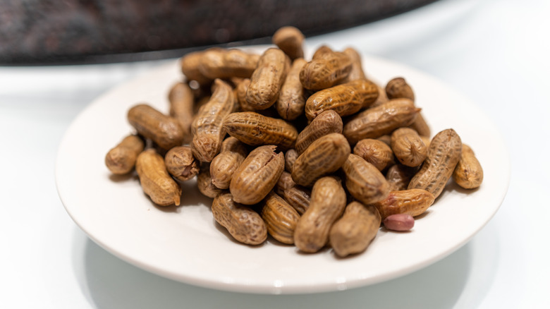 A plate filled with boiled peanuts