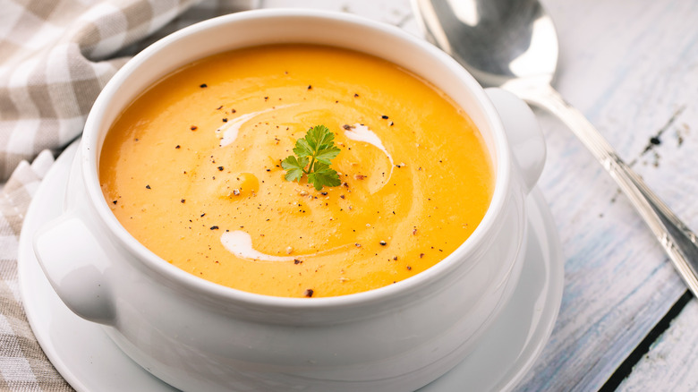 Traditional pumpkin soup in a white bowl