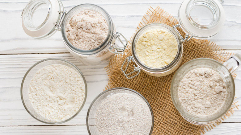 A variety of flours in open glass containers