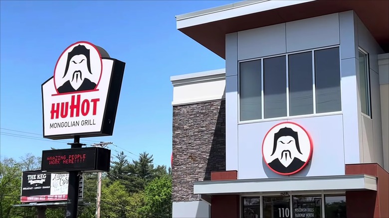 A HuHot Mongolian Grill store front and sign