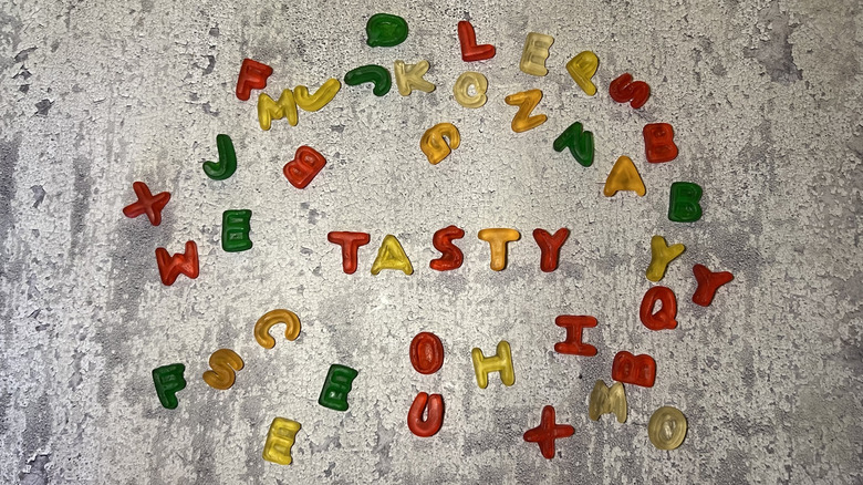 Alphabet Letters gummies spell out the word "Tasty"