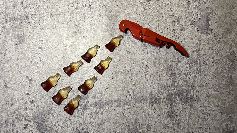 Happy Cola gummies in the shape of a soda bottle with bottle opener