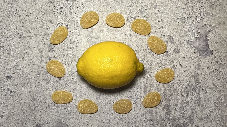 a lemon is surrounded by Ginger-Lemon gummies