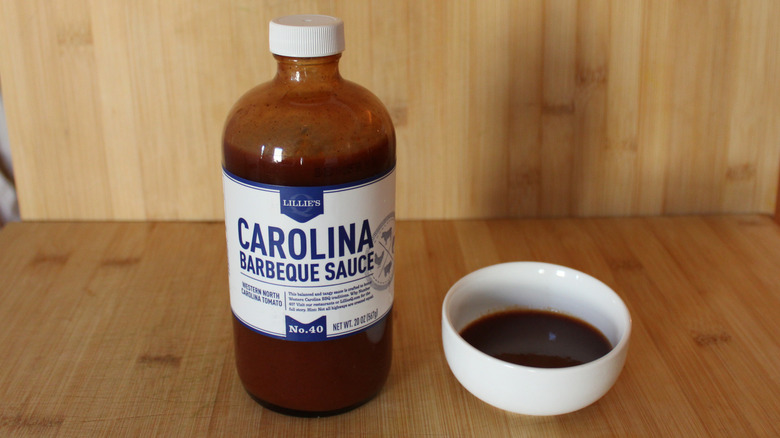 Container and bowl of Lillie Q's Carolina barbecue sauce