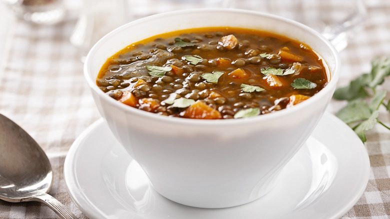 Lentil soup in a white bowl