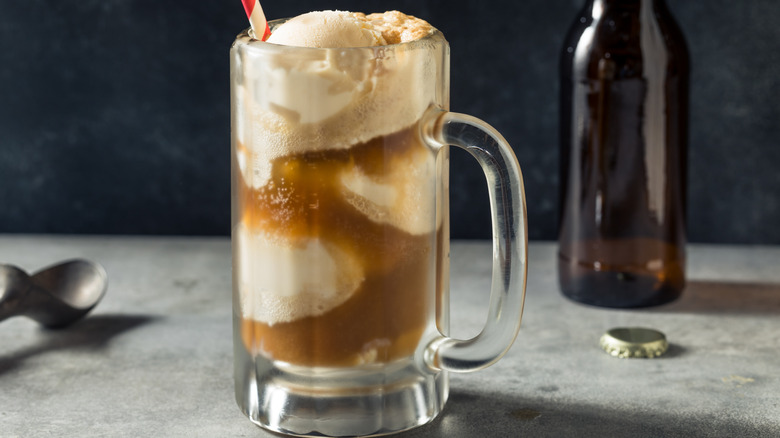 A root beer float in a beer mug