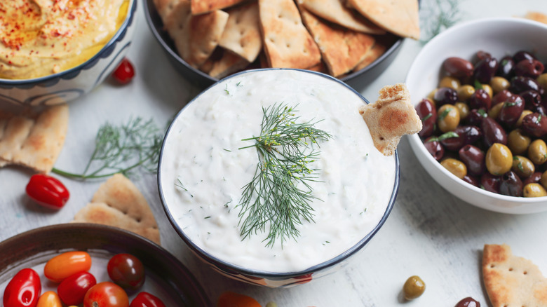 Mediterranean spread with tzatziki, olives, pita, hummus, and tomatoes