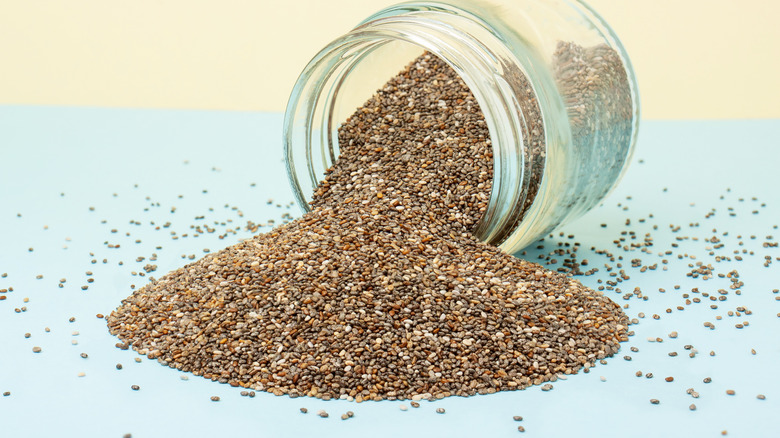 Chia seeds poured from a jar