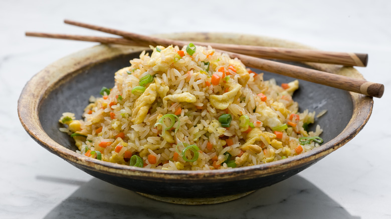 Bowl of fried rice with chopsticks