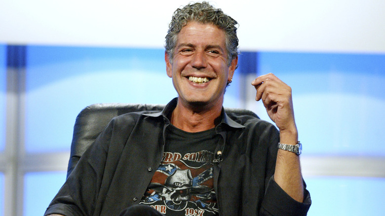 Anthony Bourdain seated, smiling