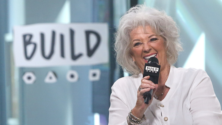 Paula Deen holding mic