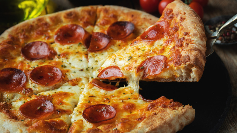 homemade pepperoni pizza being served