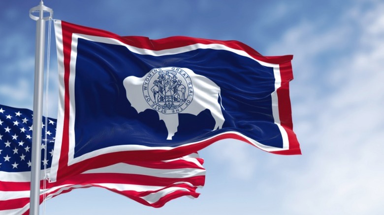 The flag of Wyoming, along with the American flag.