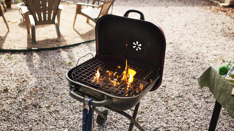 Charcoal grill in backyard