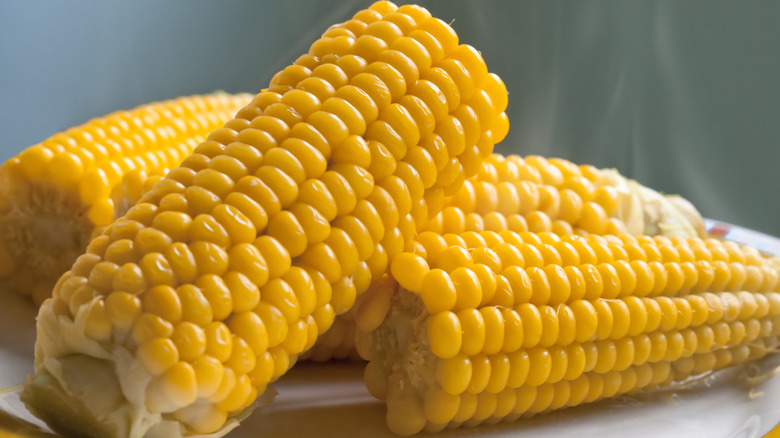 A few pieces of steaming cooked corn